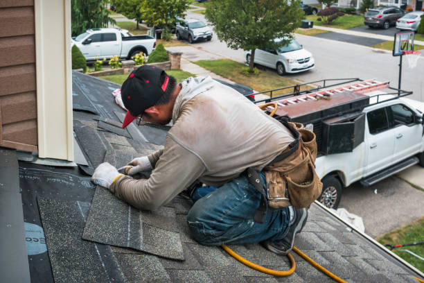 Professional Roofing technician working in Woodrow, CO